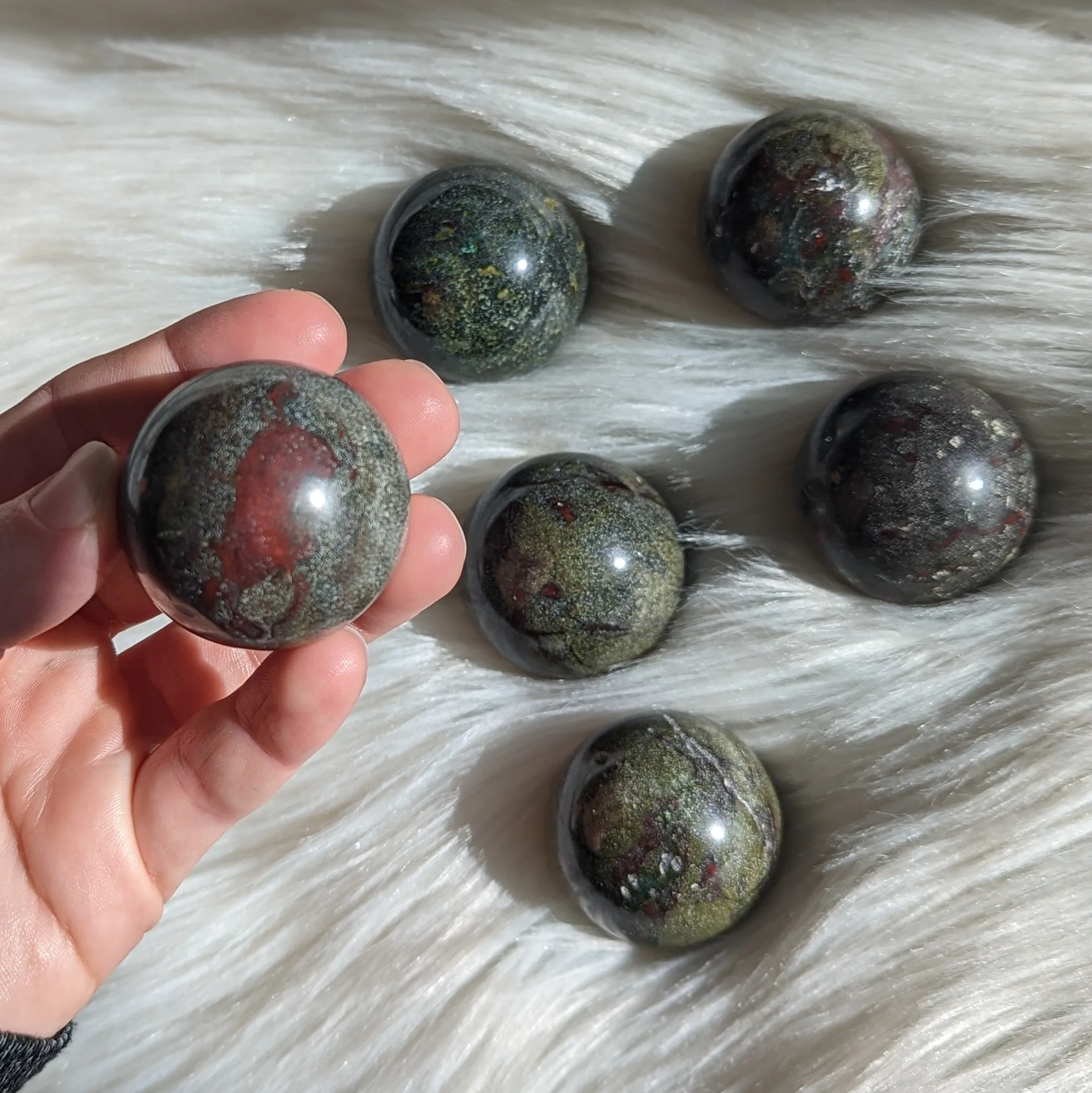 One Dragons Blood Jasper Sphere Carving